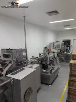 Linha para embalagem farmac�utica blistadeira encartuchadeira Uhlmann