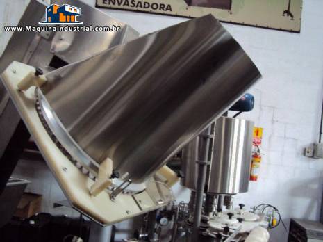 Alimentador e posicionador de tampas rotativo autom�tico