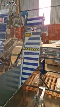 Alimentador posicionador abastecedor vibrat�rio em a�o inox de tampas TecnoEnvase TAG 5000